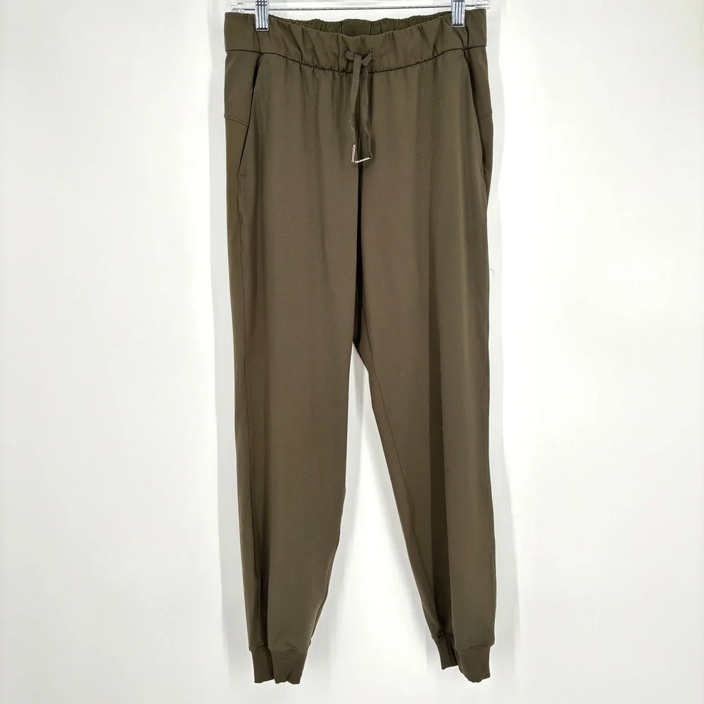 Lululemon‎ On The Fly Jogger 7/8 Mid Rise Olive Green Stretch Drawstring Size 6